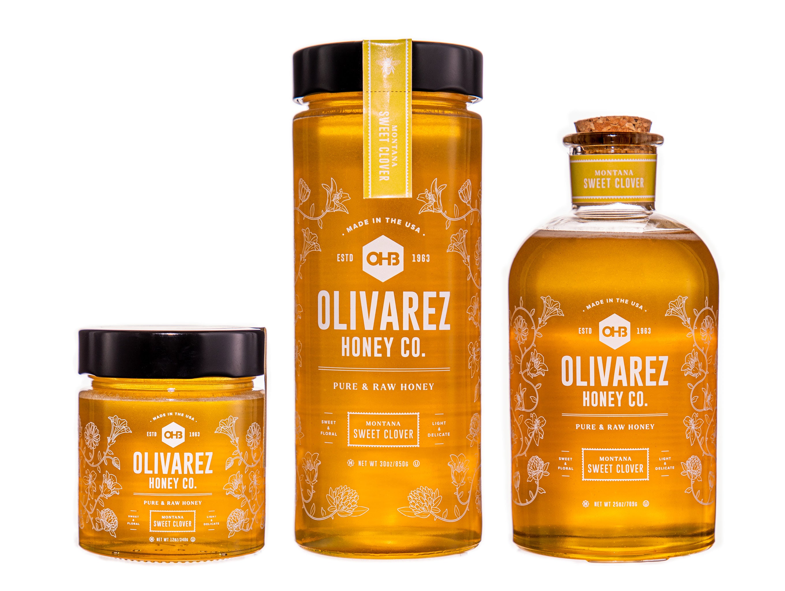 Three jars of Olivarez Honey Co. clover honey products on white background